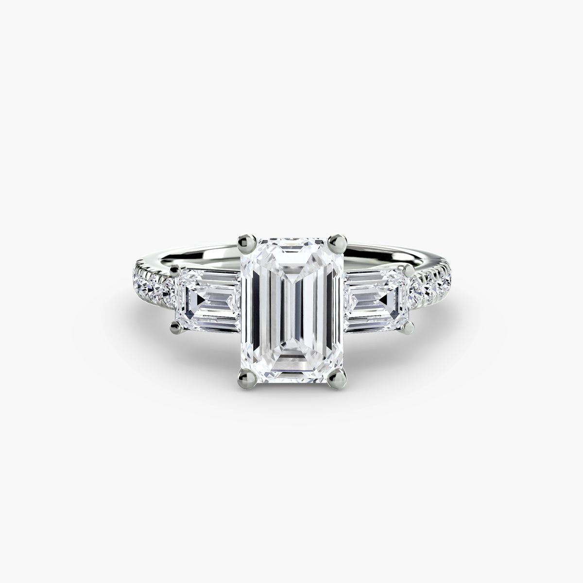 The Clara Three-Stone Ring with Pavé Band Setting
