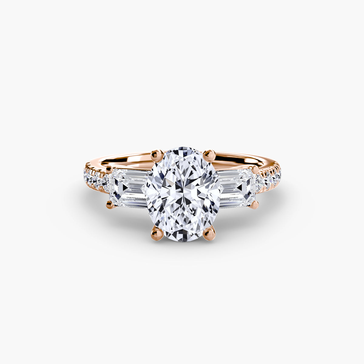 The Clara Three-Stone Ring with Pavé Band Setting