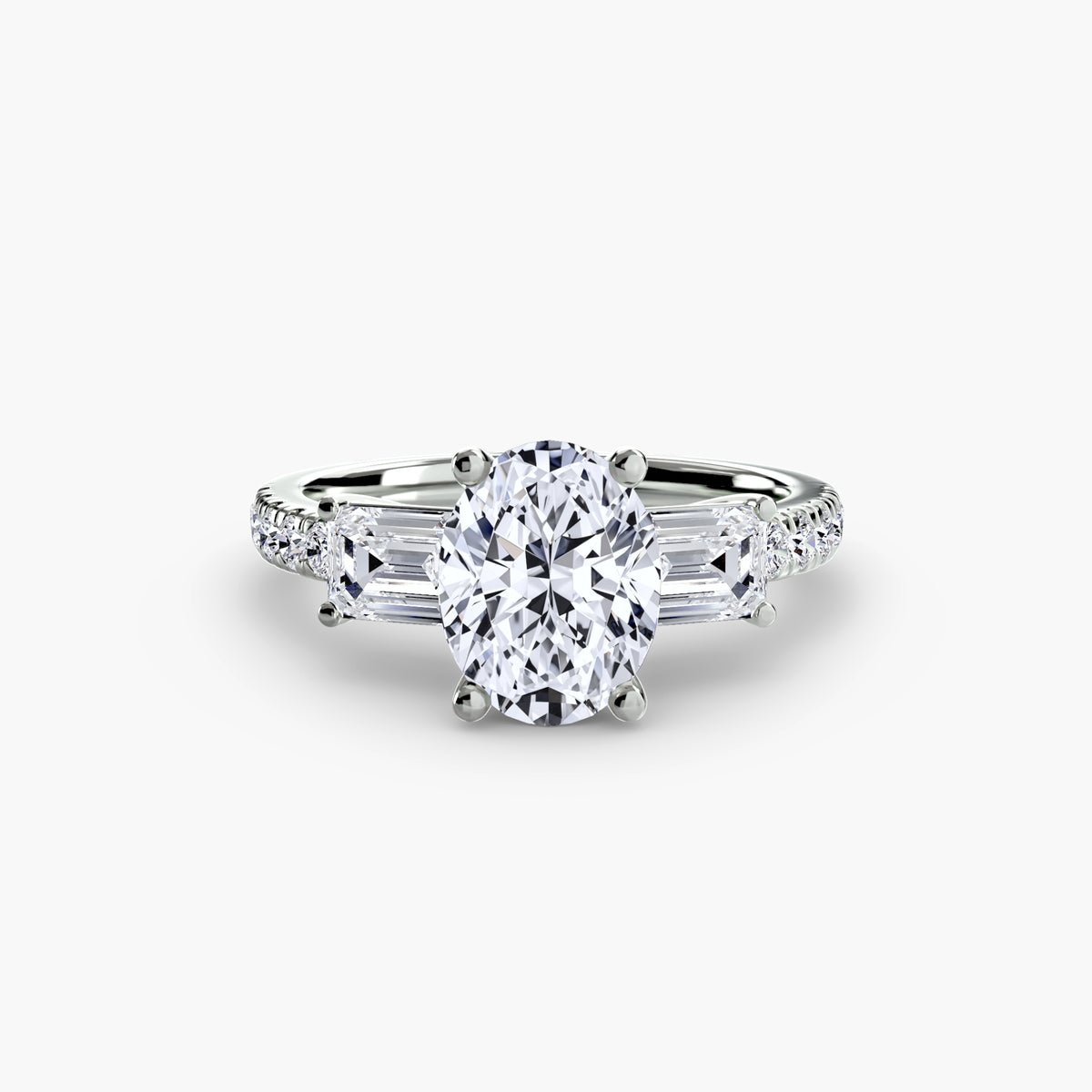The Clara Three-Stone Ring with Pavé Band Setting