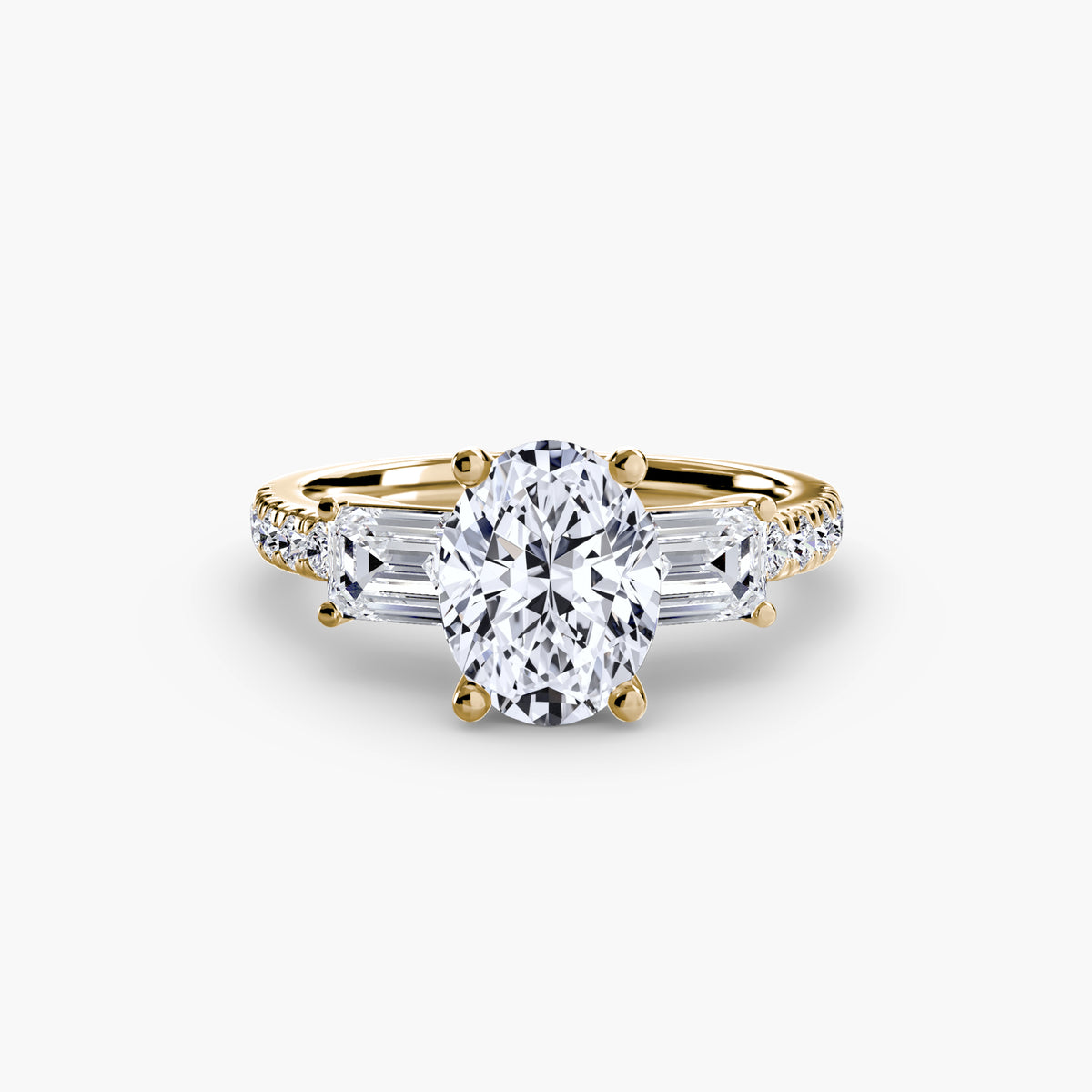 The Clara Three-Stone Ring with Pavé Band Setting