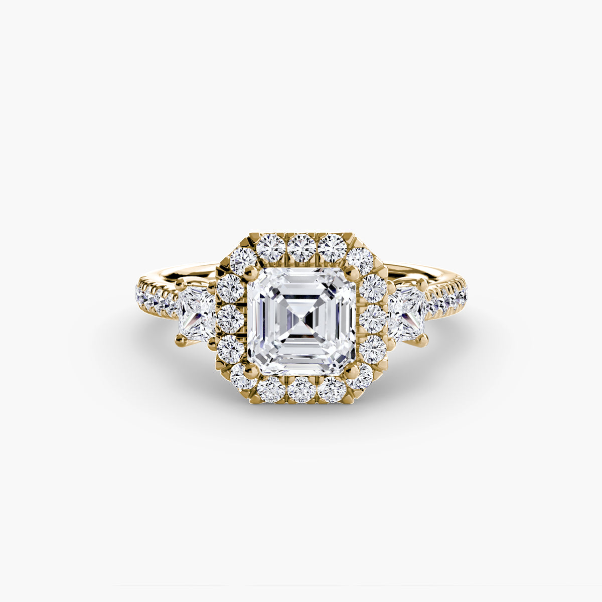 The Amélie Three-Stone Ring with Halo Setting
