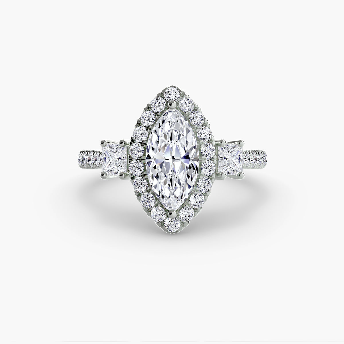The Amélie Three-Stone Ring with Halo Setting