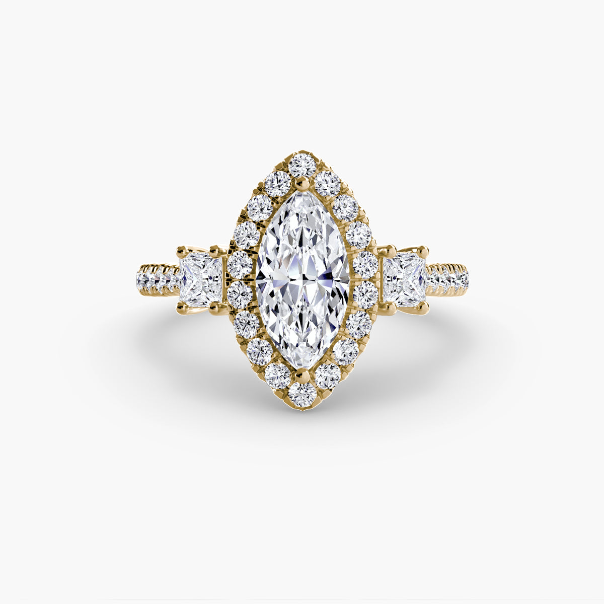The Amélie Three-Stone Ring with Halo Setting