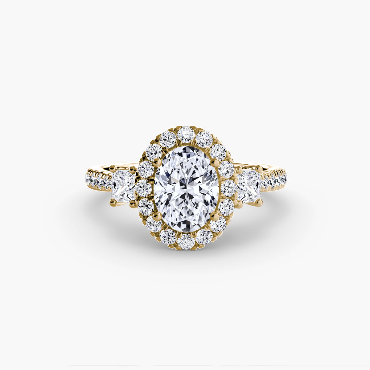 The Amélie Three-Stone Ring with Halo Setting