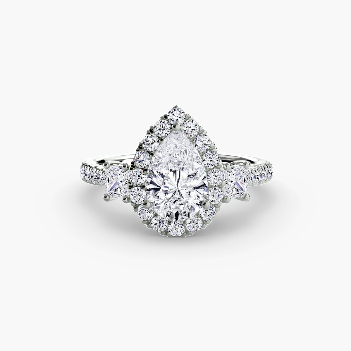 The Amélie Three-Stone Ring with Halo Setting