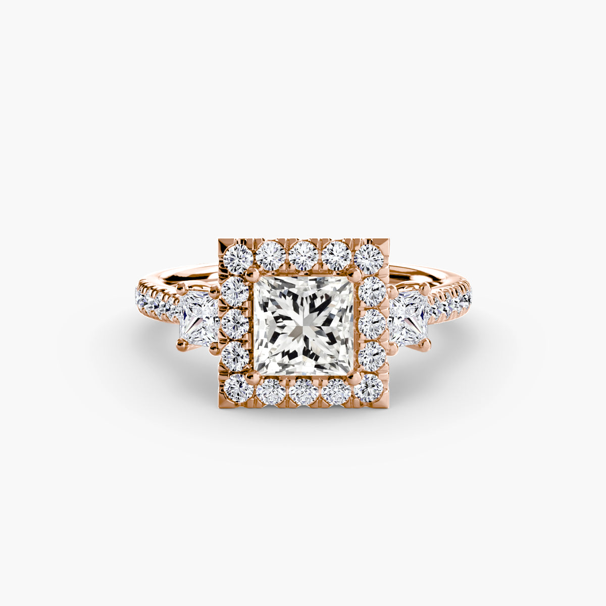 The Amélie Three-Stone Ring with Halo Setting