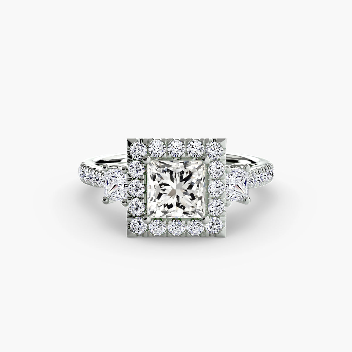 The Amélie Three-Stone Ring with Halo Setting