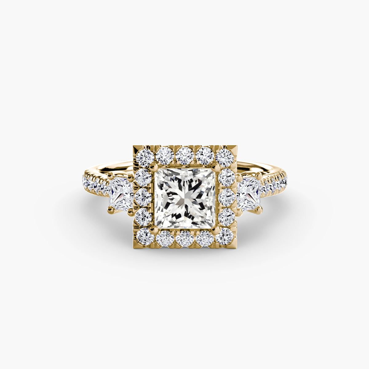 The Amélie Three-Stone Ring with Halo Setting
