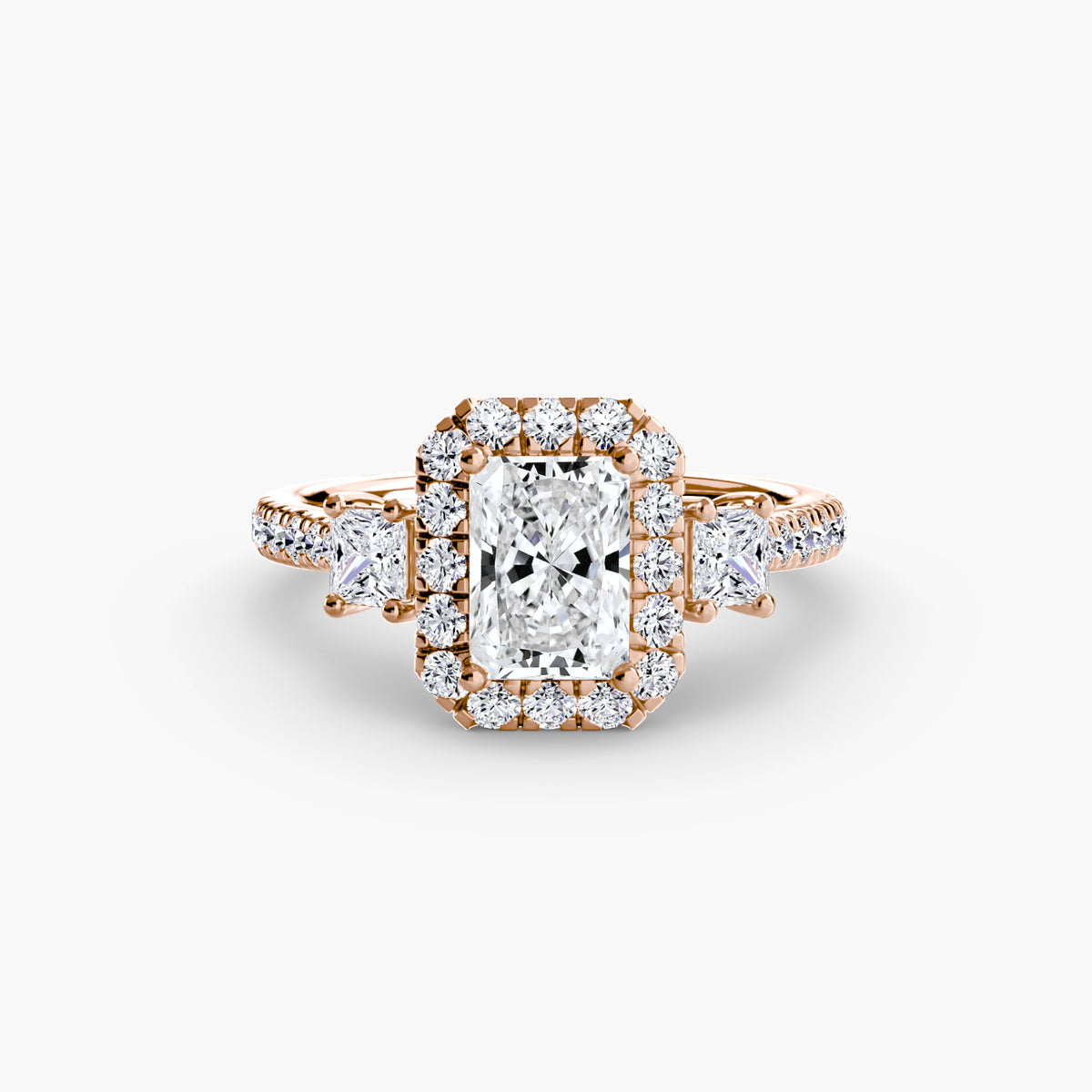 The Amélie Three-Stone Ring with Halo Setting