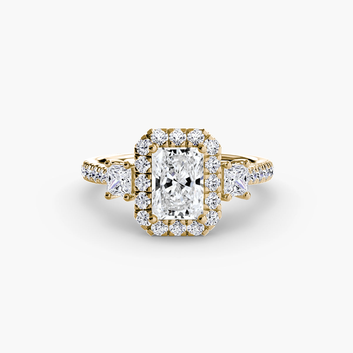 The Amélie Three-Stone Ring with Halo Setting