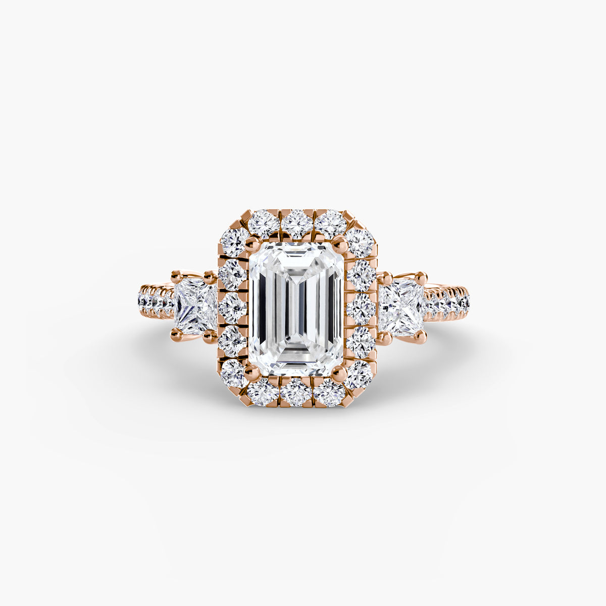 The Amélie Three-Stone Ring with Halo Setting