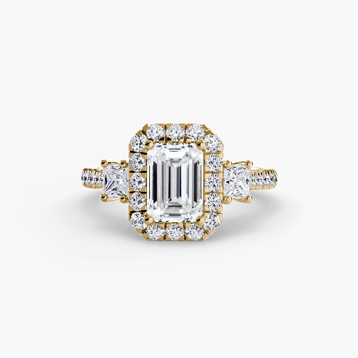 The Amélie Three-Stone Ring with Halo Setting