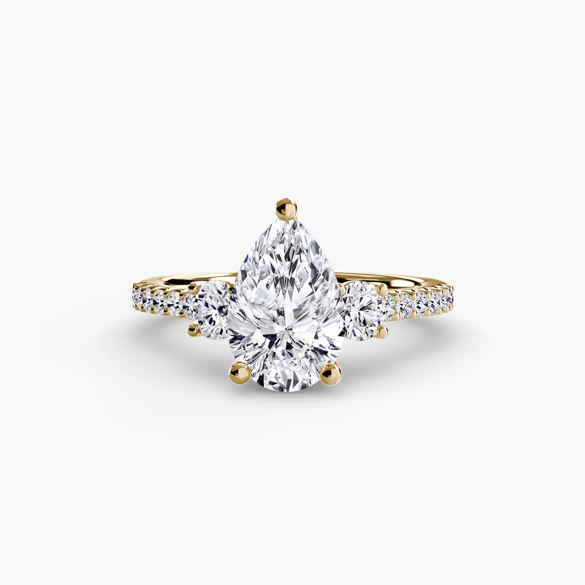 The Anaïs Three-Stone Ring with Pavé Band Setting